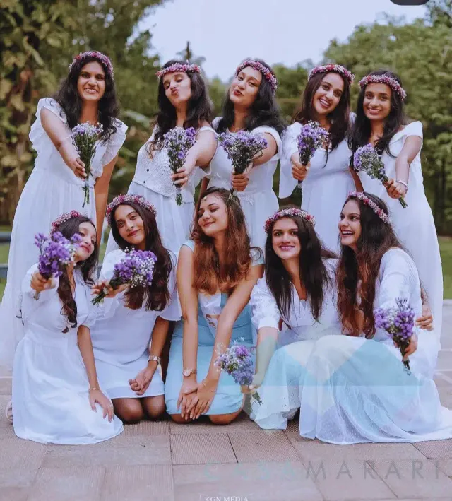 Bride-to-be with bridesmaids holding lavender bouquets
