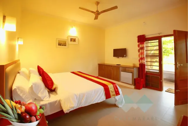 Deluxe AC room with double bed, fruit basket and garden door