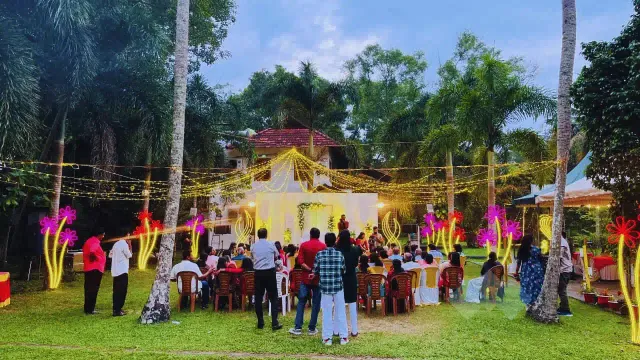 Evening garden party with fairy lights and guests