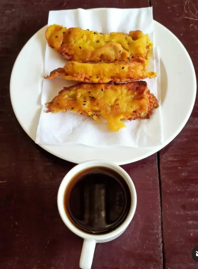 Pazhampori banana fritters with a cup of black coffee